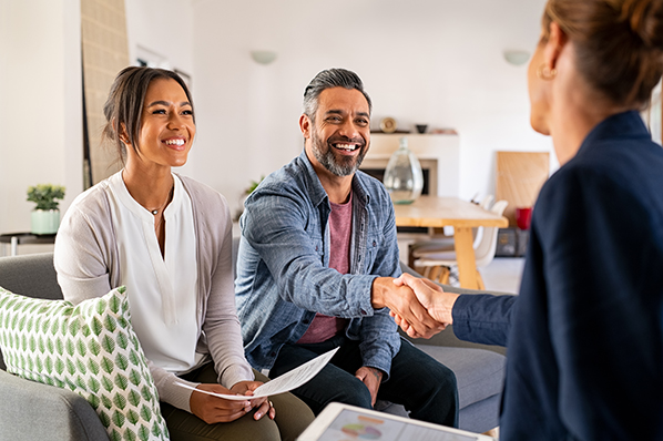 A man and a woman speaking to an advisor